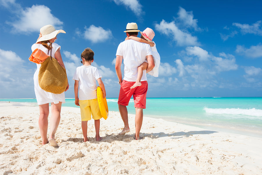 family on beach in summer