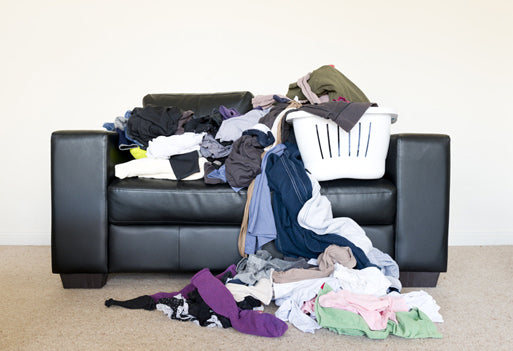 Messy Disorganized Living Room Couch Sofa Laundry Basket