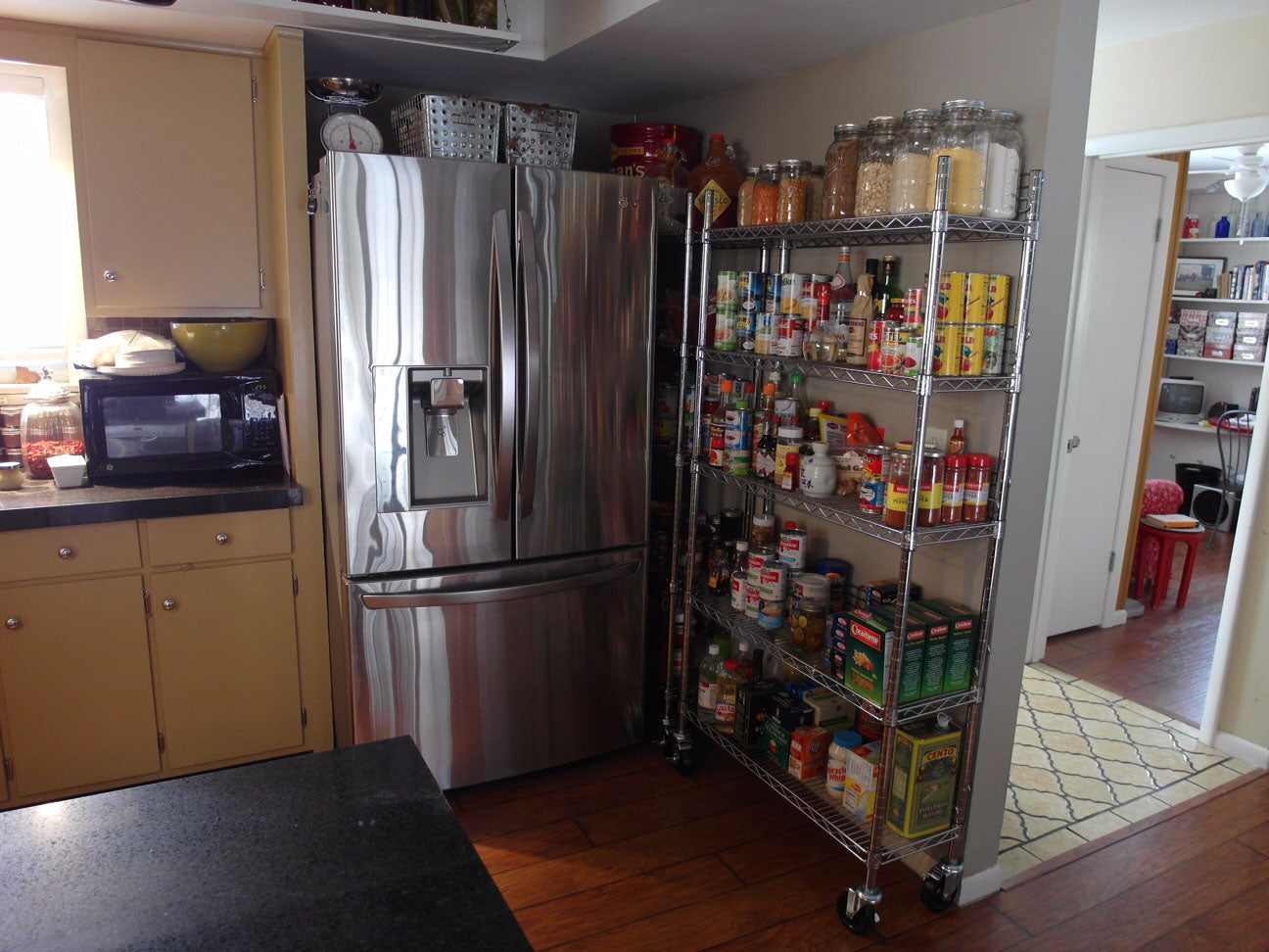 Wire Shelving Pantry Next To Fridge