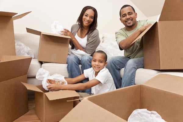 people unpacking boxes while moving