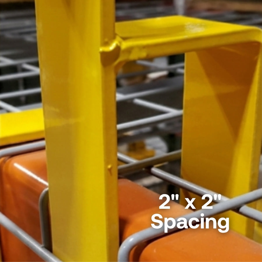 Close-up of a yellow metal frame with '2" x 2" Spacing' text, likely part of a larger structure.